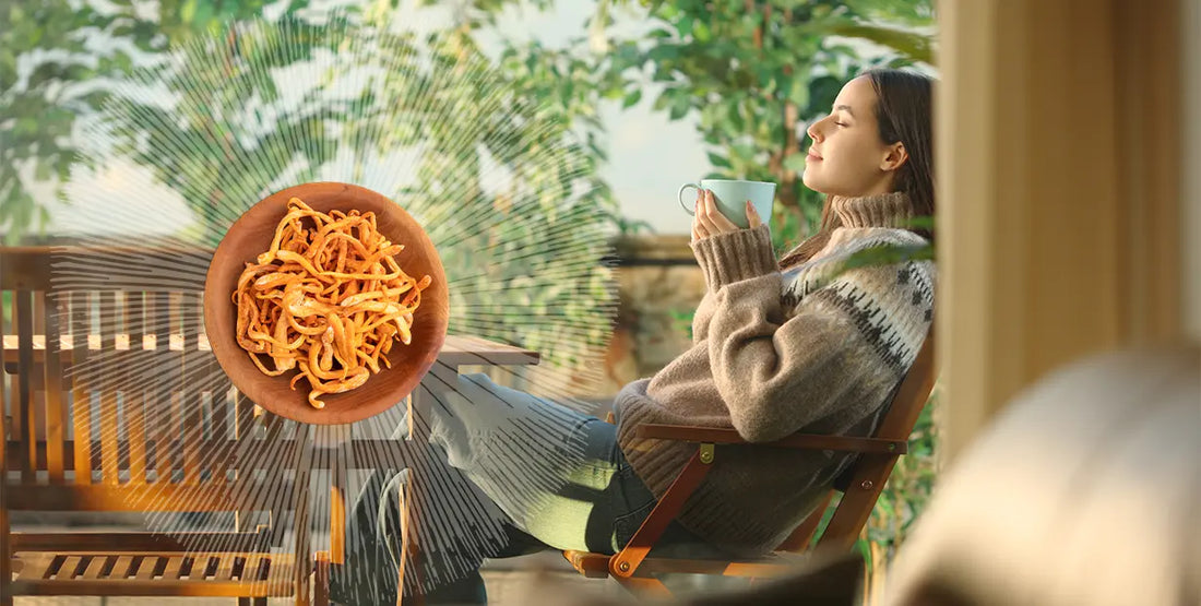A woman relaxing outside microdosing functional mushrooms